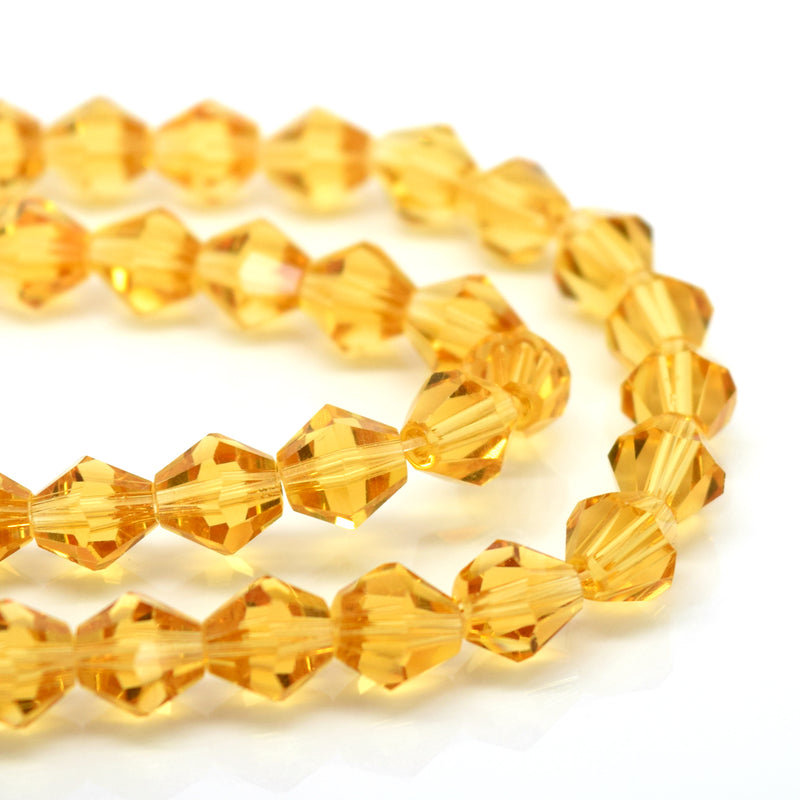 STAR BEADS: FACETED BICONE GLASS BEADS - LIGHT TOPAZ - Bicone Beads